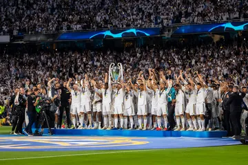 A dramatic shot of winning sevens landing on a slot reel surrounded by shining gold coins, symbolizing big wins.