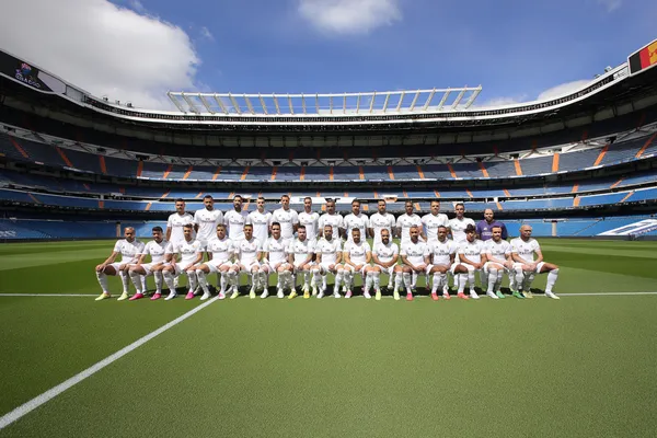 A confident dealer surrounded by casino chips inviting players to access their REAL MADRID account, reflecting quick and easy login options.